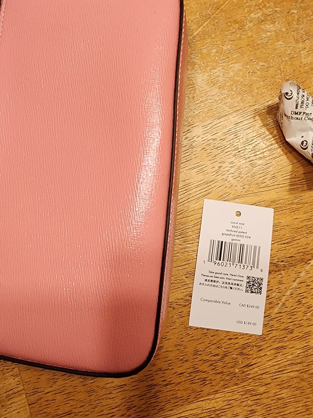 Kate Spade New York Gemini Convertible Wristlet in a pink color